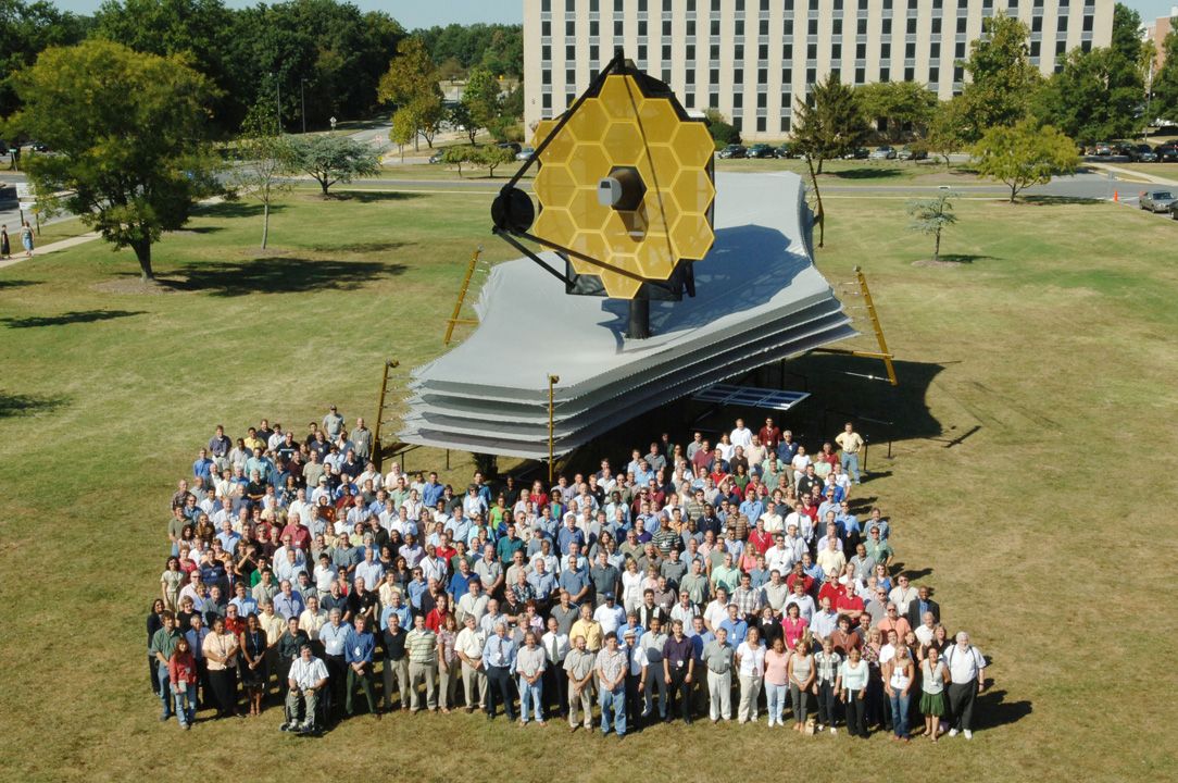 Full-scale model assembled on the lawn at Goddard Space Flight Center & the Webb Telescope team.